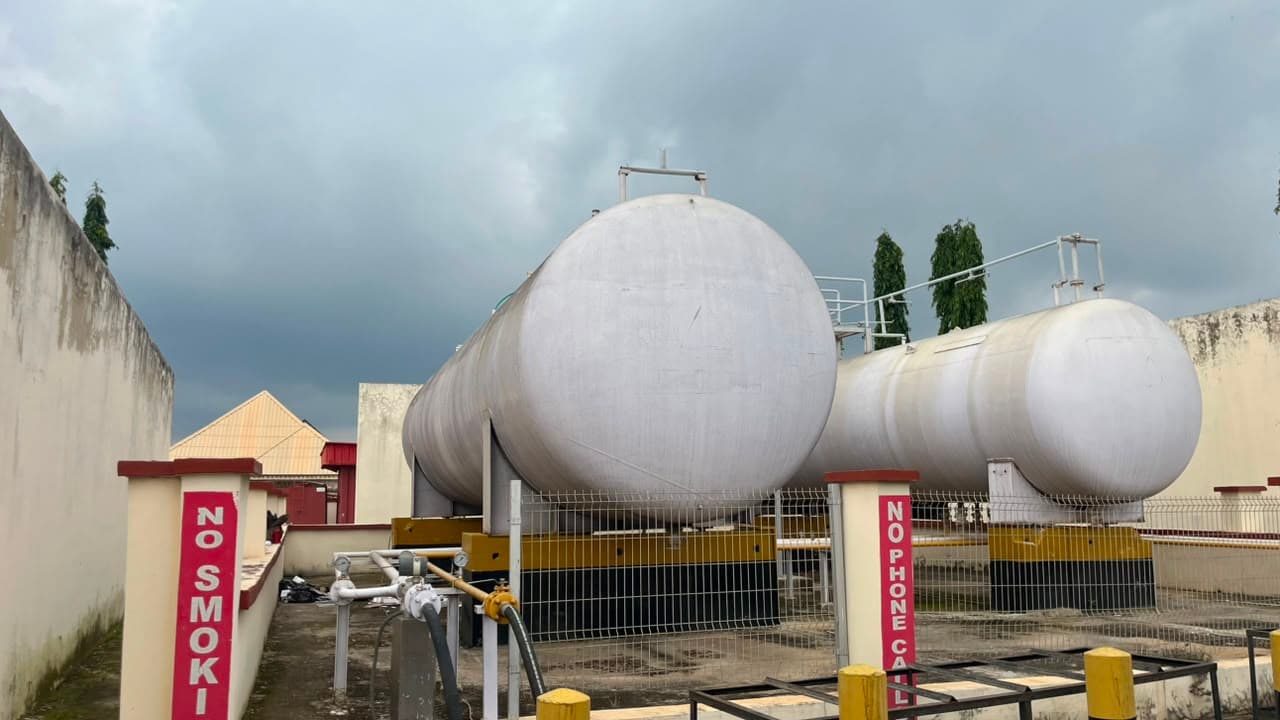 Two LPG storage tanks on load-cell mounts at a gas plant