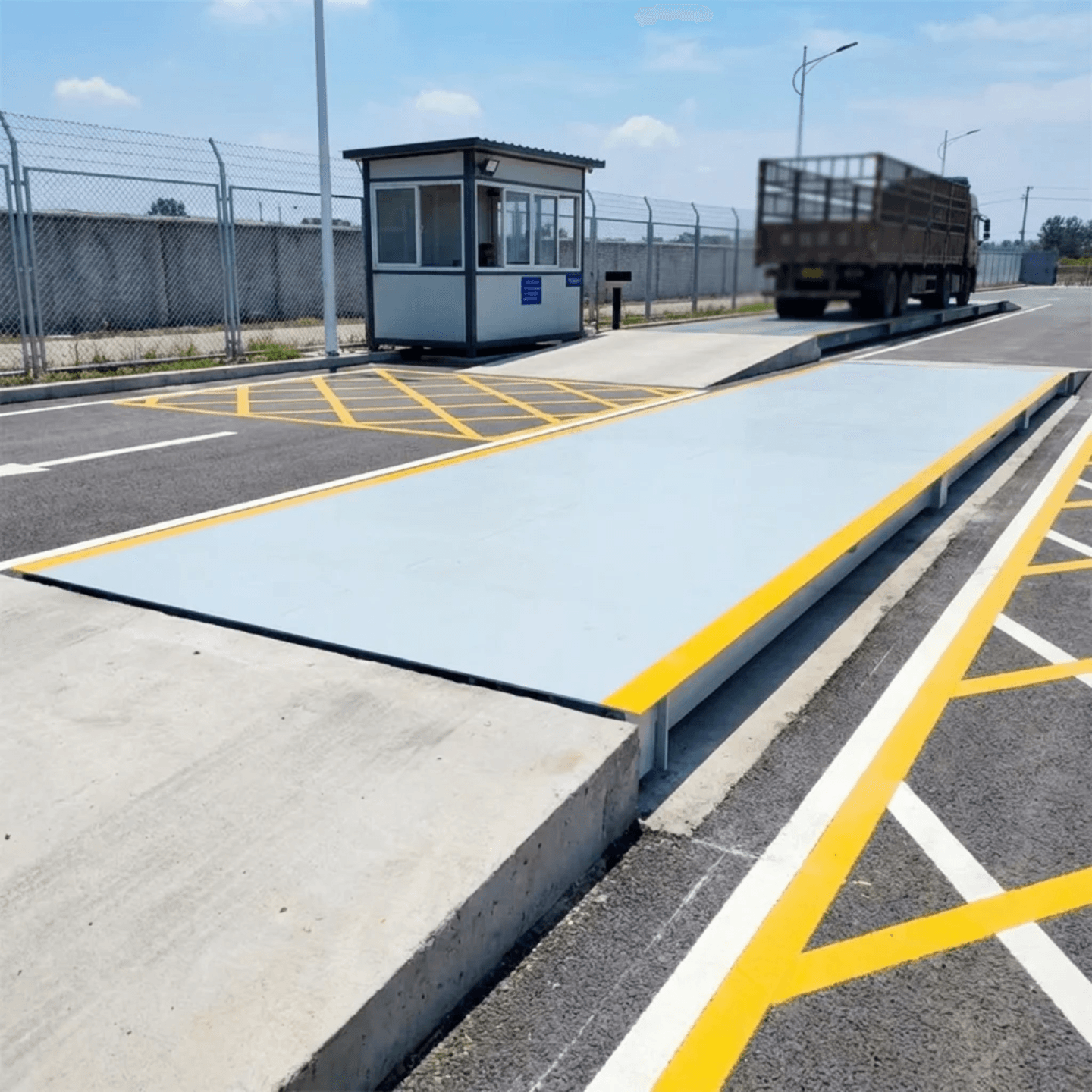Weighbridge at a site entrance with operator cabin