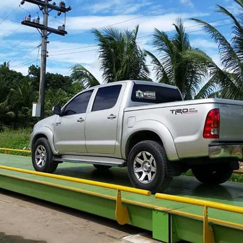 Pickup truck on a surface-mounted weighbridge